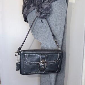 Coach EUC black leather buckle wristlet, hang tag, Extra Buckle front storage.